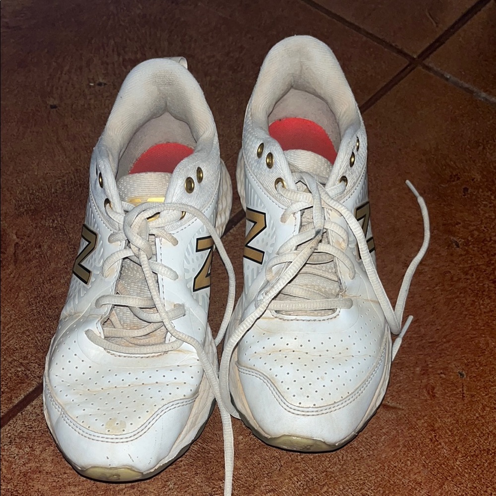 New Balance White and Gold Athletic Shoes/turf shoes